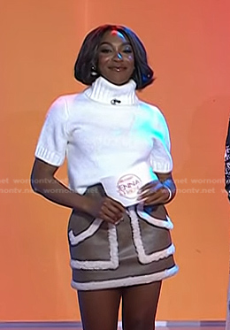Ego Nwodim's white short sleeve turtleneck and brown sherpa trim leather skirt on Today