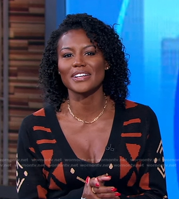 Janai's black and orange print cardigan dress on Good Morning America