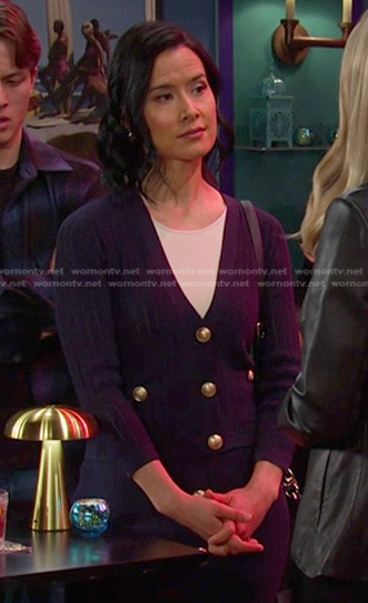 Amy Choi's navy cardigan and knit skirt with gold buttons on Days of our Lives