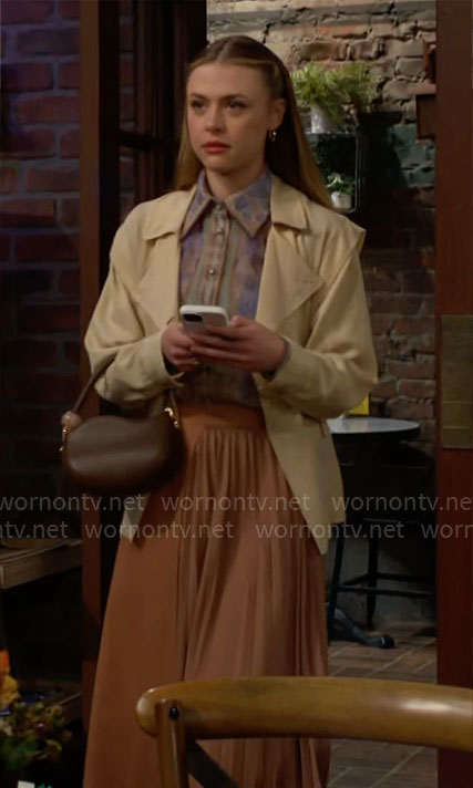 Claire's printed button down blouse and pleated skirt on The Young and the Restless