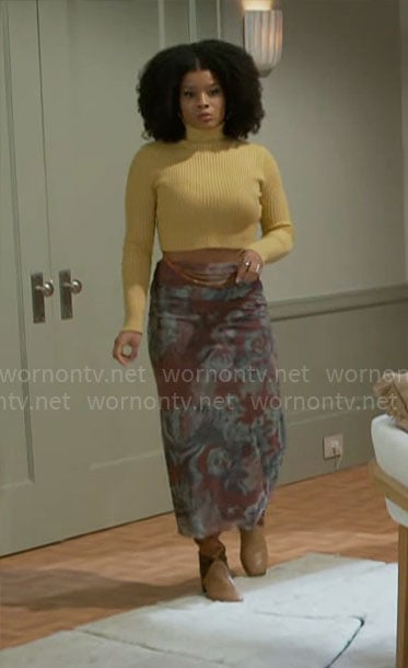 Eva's yellow cropped turtleneck and printed mesh skirt on Beyond the Gates