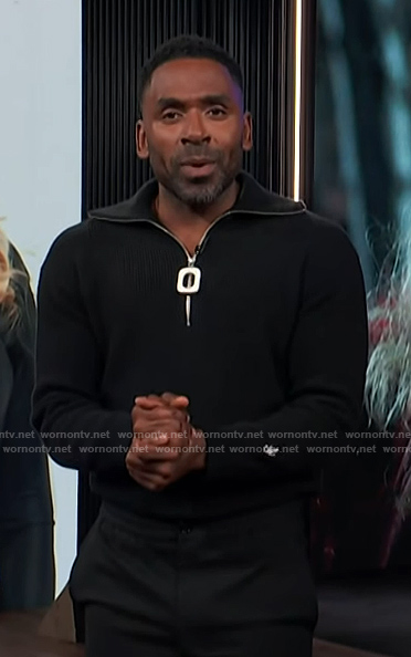 Justin's black half zip sweater on E! News