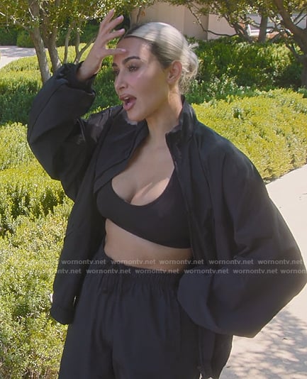 Kim's black scoop neck sports bra on The Kardashians