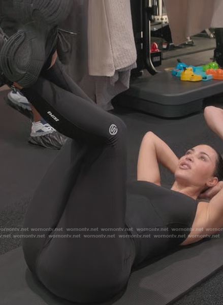Kim's black leggings with logo on The Kardashians
