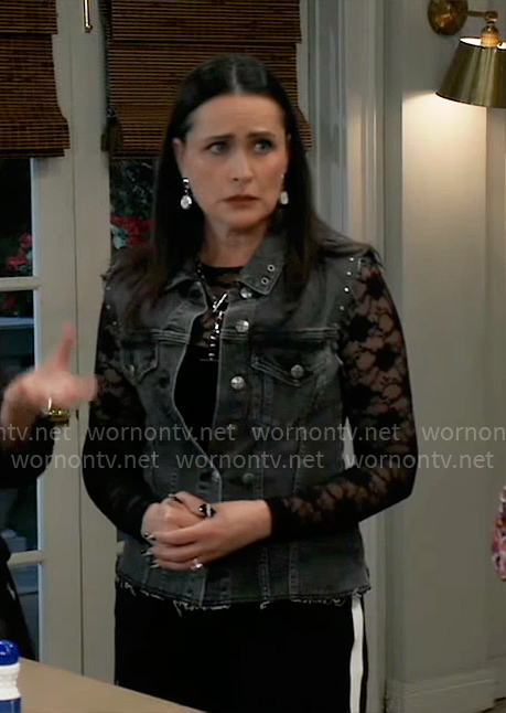 Lois's studded denim vest and clock earrings on General Hospital