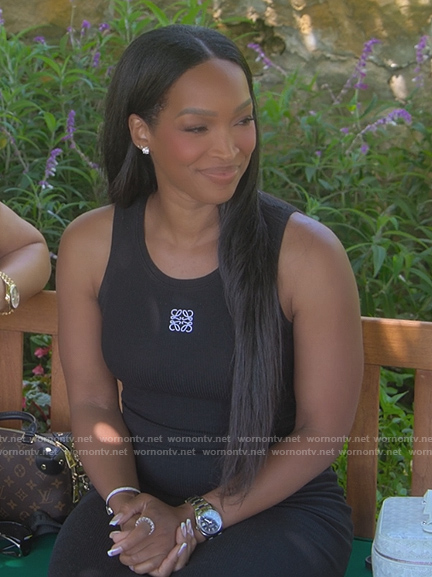 Malika Haqq's black logo sleeveless dress on The Kardashians
