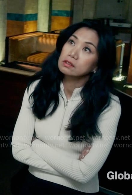 Mel's white zip neck knit top on The Equalizer