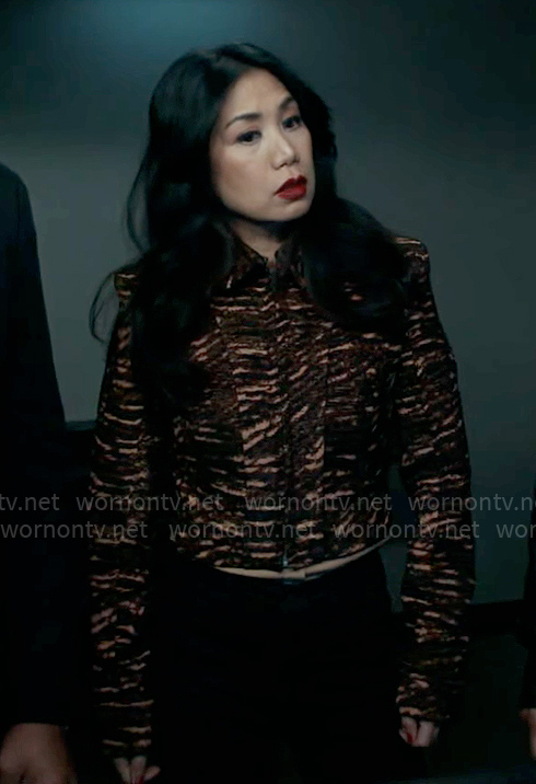 Mel's coral and black printed jacket on The Equalizer