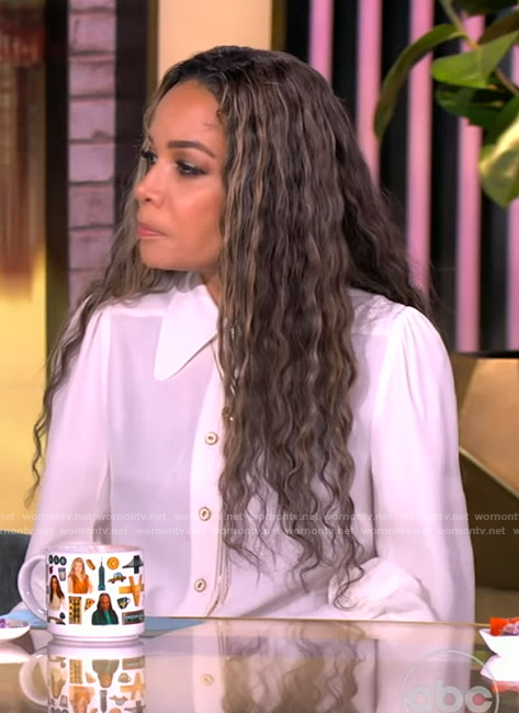 Sunny's white pendant blouse on The View