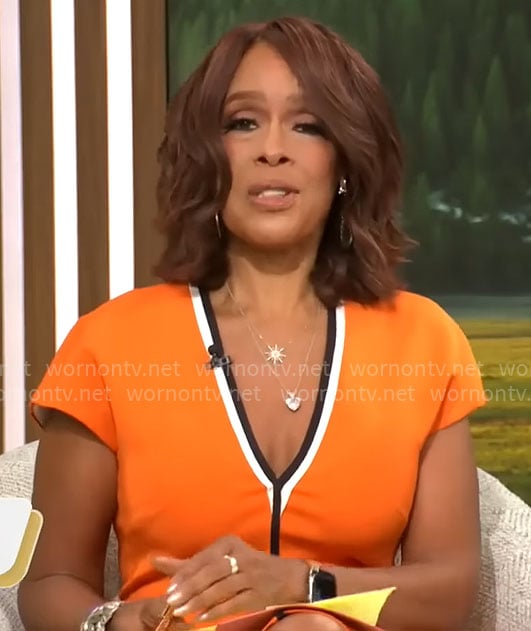 Gayle King's orange v-neck dress with black trim on CBS This Morning