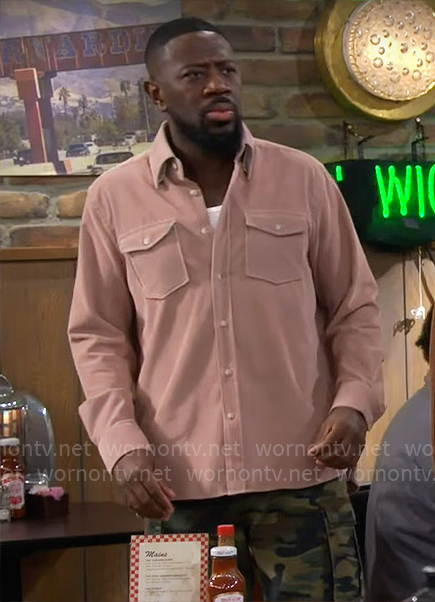 Malcolm's pink button down shirt on The Neighborhood