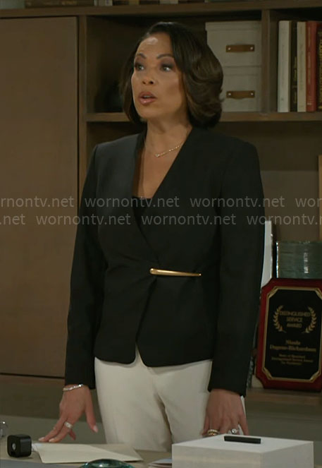 Nicole's black blazer with gold detail on Beyond the Gates