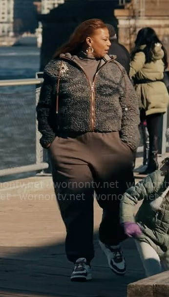 Robyn's fleece jacket with eye brooch on The Equalizer