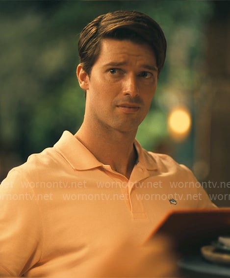 Saxon's orange polo shirt on The White Lotus