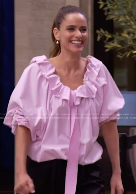 Amanda Peet's pink ruffle neck blouse on Live with Kelly and Mark