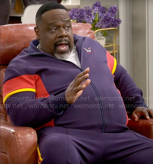 Calvin's navy colorblock tracksuit on The Neighborhood