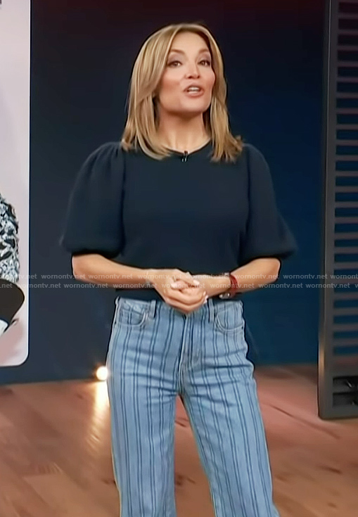 Kit's navy puff sleeve top and striped jeans on Access Hollywood