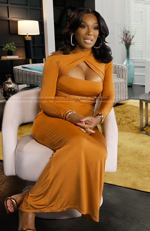 Angela's orange cutout confessional dress on The Real Housewives of Atlanta