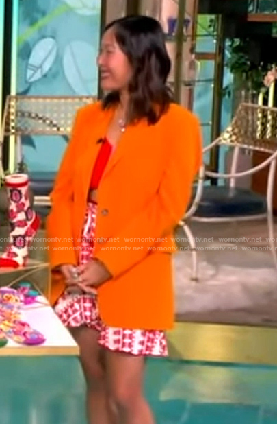Mary Gui's orange blazer and printed mini skirt on The View