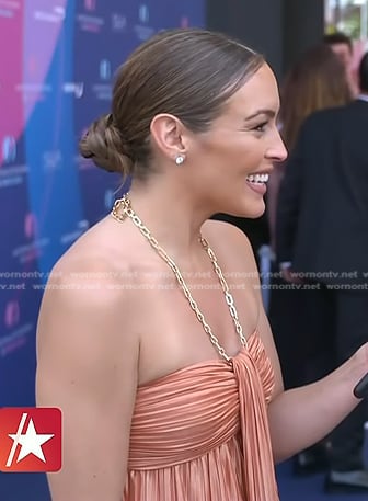 Emily's coral pleated dress with chain strap on Access Hollywood