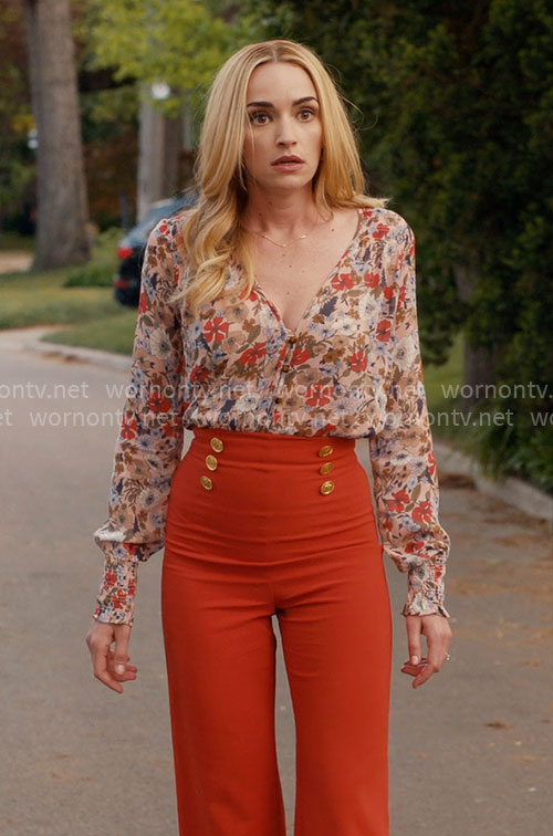 Georgia's floral blouse and orange pants on Ginny & Georgia
