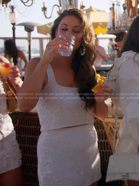 Nia's white sequin top and mini skirt on The Valley
