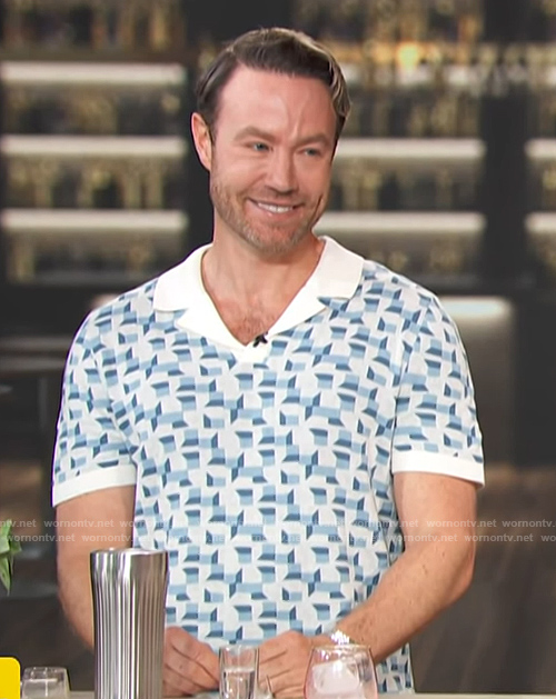 Paul Zahn's blue geometric print polo on Access Hollywood
