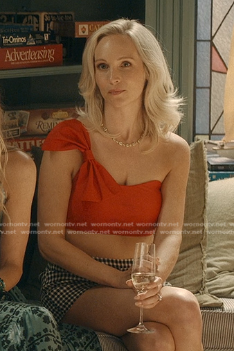 Bess's red one shoulder bow top and check shorts on We Were Liars