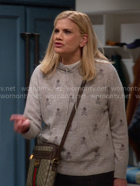 Carol's grey skull and crossbones hoodie sweater on Leanne