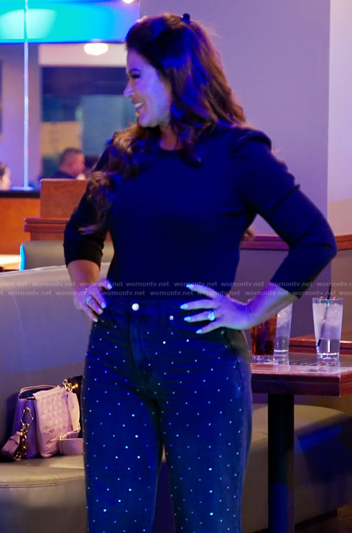 Emily's black puff sleeve top and embellished jeans on The Real Housewives of Orange County