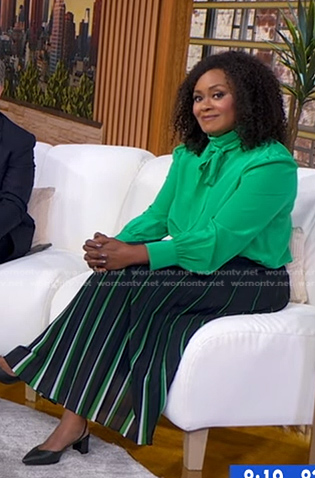 Ericka Sóuter's navy stripe pleated skirt on Good Morning America