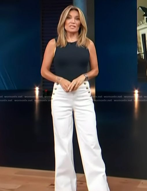 Kit's white button detail white pants on Access Hollywood