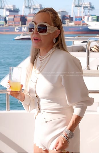 Marysol's white scalloped cardigan and shorts on The Real Housewives of Miami