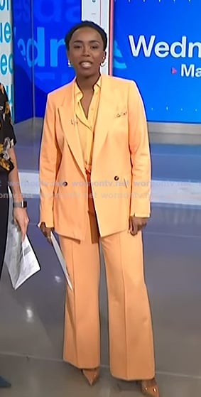 Zinhle's orange blazer and wide leg pants on NBC News Daily