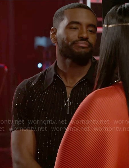 Andre's black rhinestone studded polo shirt on Beyond the Gates