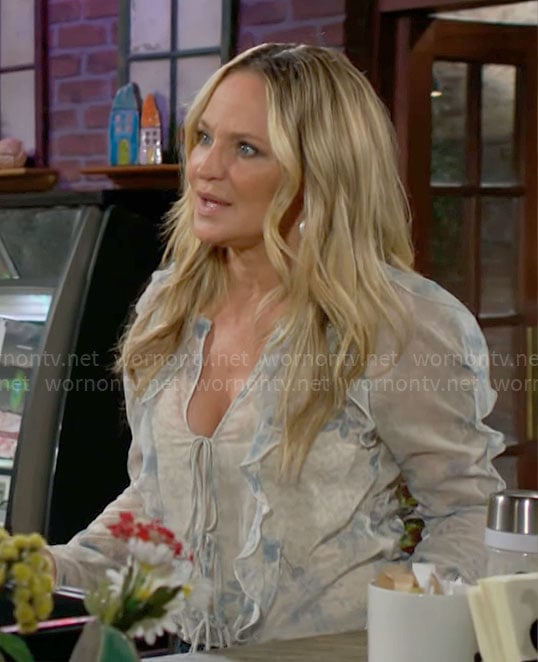 Sharon's floral ruffled blouse on The Young and the Restless