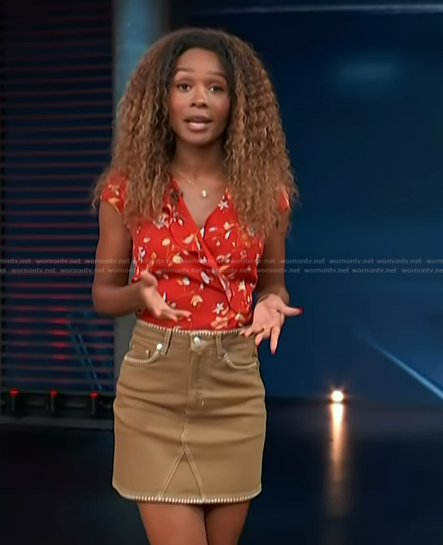 Zuri's red floral print top and denim mini skirt on Access Hollywood