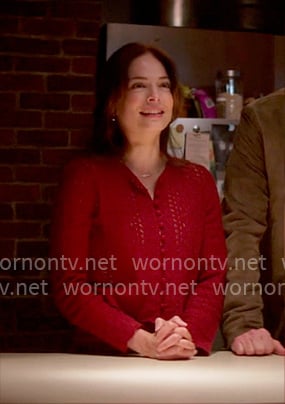 Cassandra's red pointelle knit cardigan on Murder in a Small Town