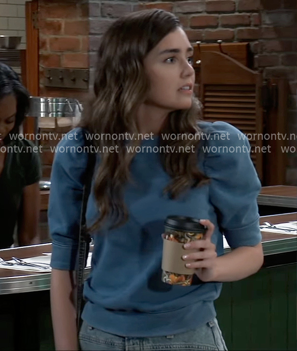 Emma's blue puff-sleeve sweatshirt on General Hospital