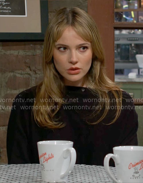 Tessa's black button detail sweater on The Young and the Restless