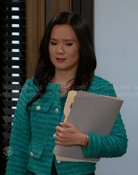 Caroline's green tweed jacket with jewel buttons on Beyond the Gates