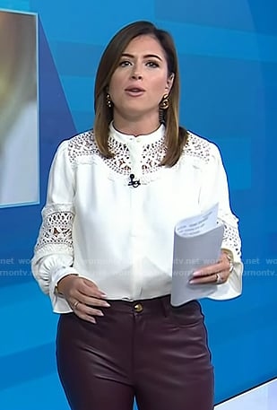 Chloe's white lace blouse and leather flare pants on Today