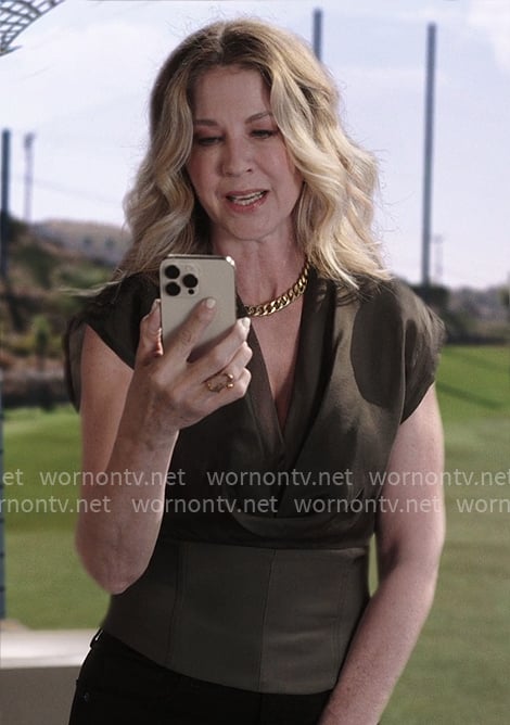 Eve's olive v-neck top on Shifting Gears