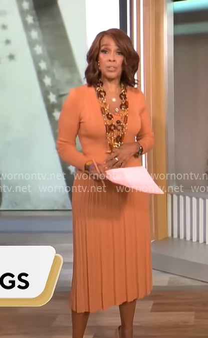 Gayle King's orange rib knit pleated dress on CBS Mornings