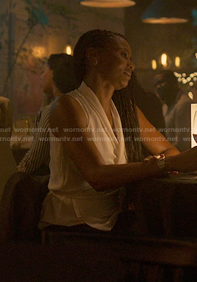 Jax's white sleeveless wrap top on Reasonable Doubt