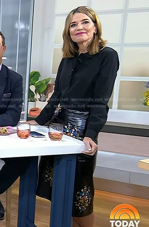 Savannah's black tie neck blouse and floral leather skirt on Today