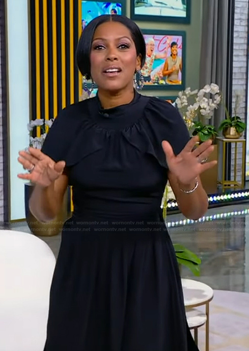 Tamron's black cape dress on Tamron Hall Show