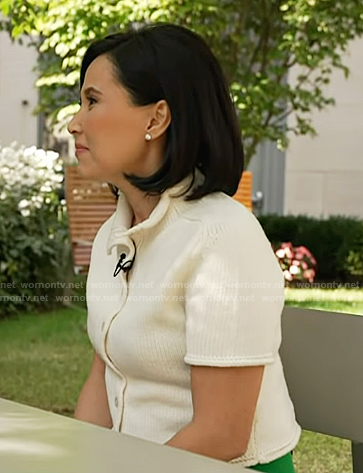 Vicky's white short sleeve cardigan and green pants on NBC News Daily