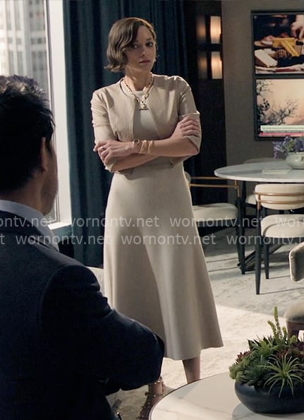 Celine's beige midi dress with cropped leather jacket on The Morning Show