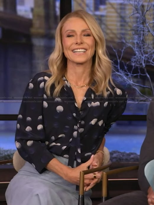 Kelly's navy dotted tie neck blouse on Live with Kelly and Mark